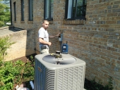 Heating, Air conditioning, HVAC services in Maryland and Northern Virginia Installing outdoor HVAC condenser unit